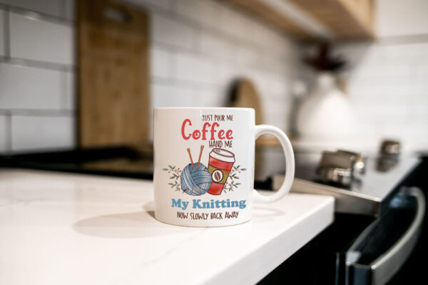 "Pour me coffee hand me my knitting now slowly back away" (Funny Novelty Mug) Kitchen Work Top Cup View